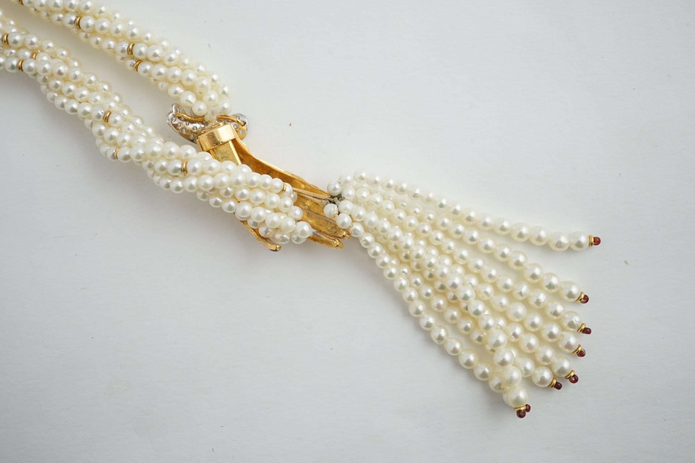 A modern cultured pearl torsade necklace, with gold and diamond cluster set hand clasp